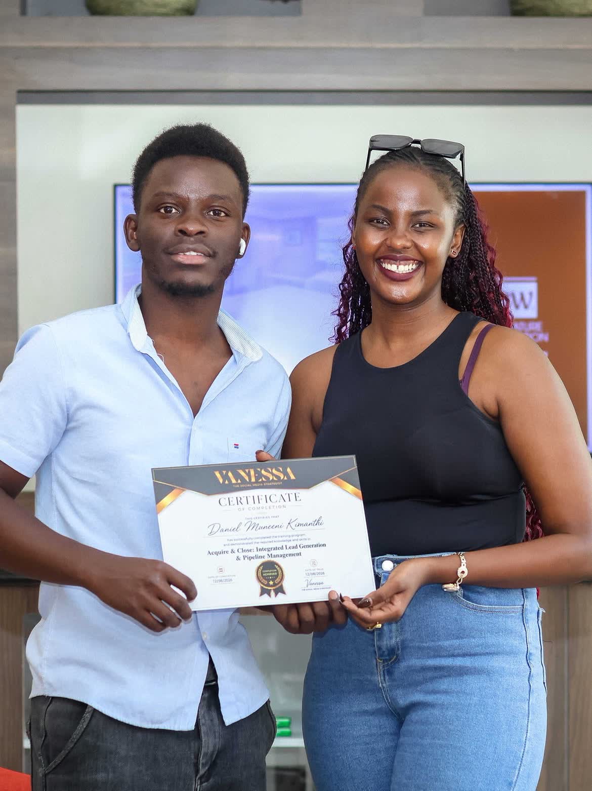 Another team member receiving a certificate