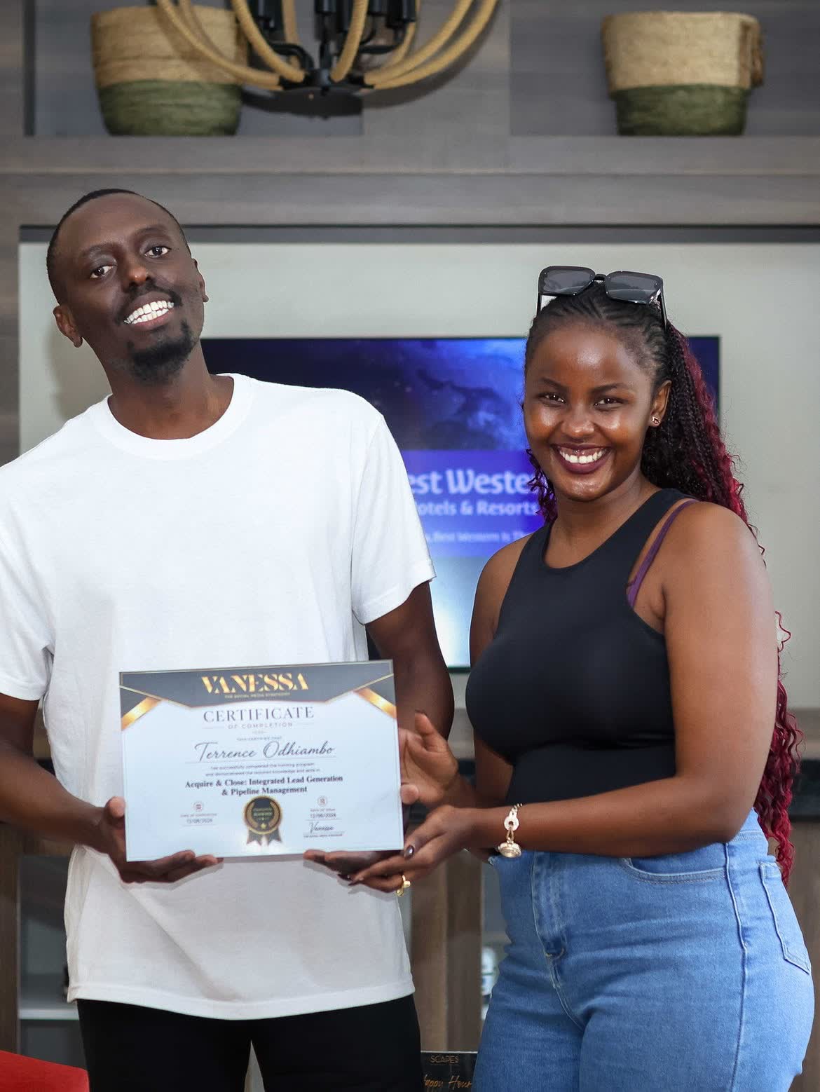 Vanessa handing over a certificate